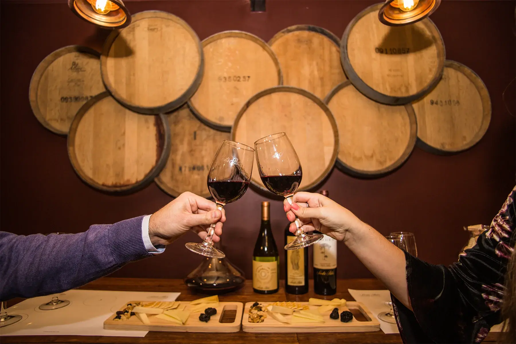 Wine tasting beside historic barrels at Santa Rita